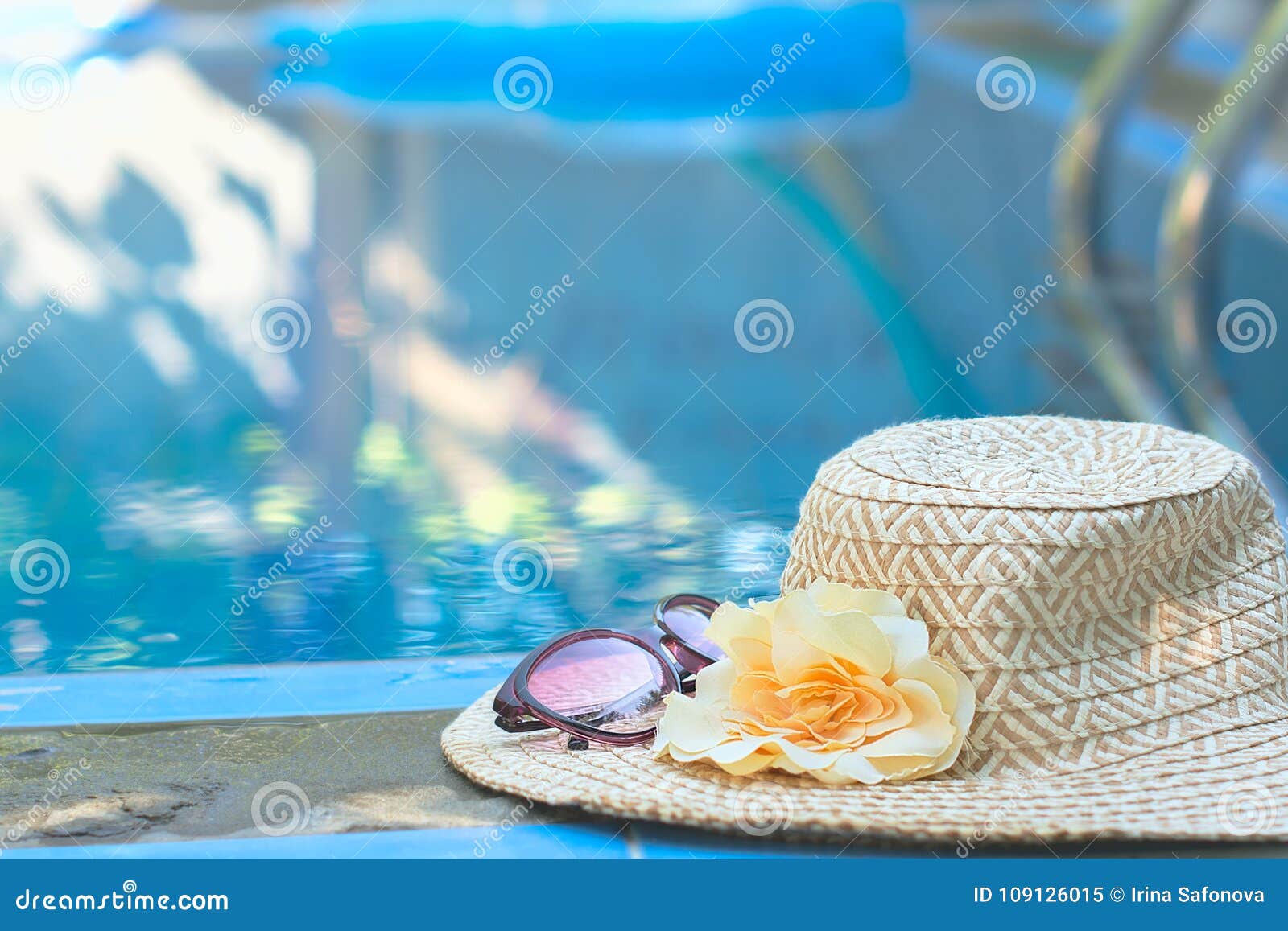 Beautiful Summer Hat and Sunglasses at the Side of Swimming Pool ...