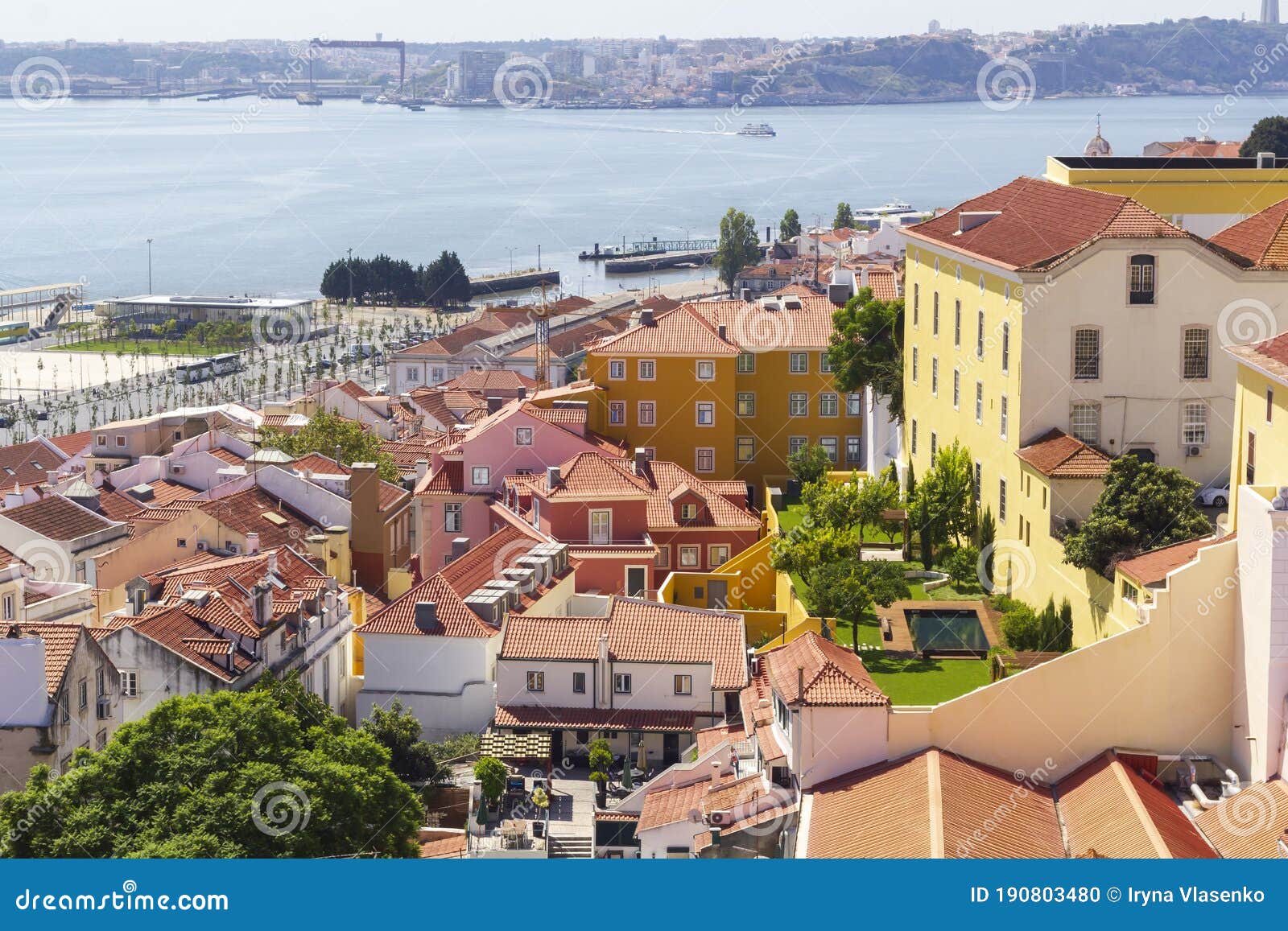 sun-lit panorama of the red-tiled lisbon roofs