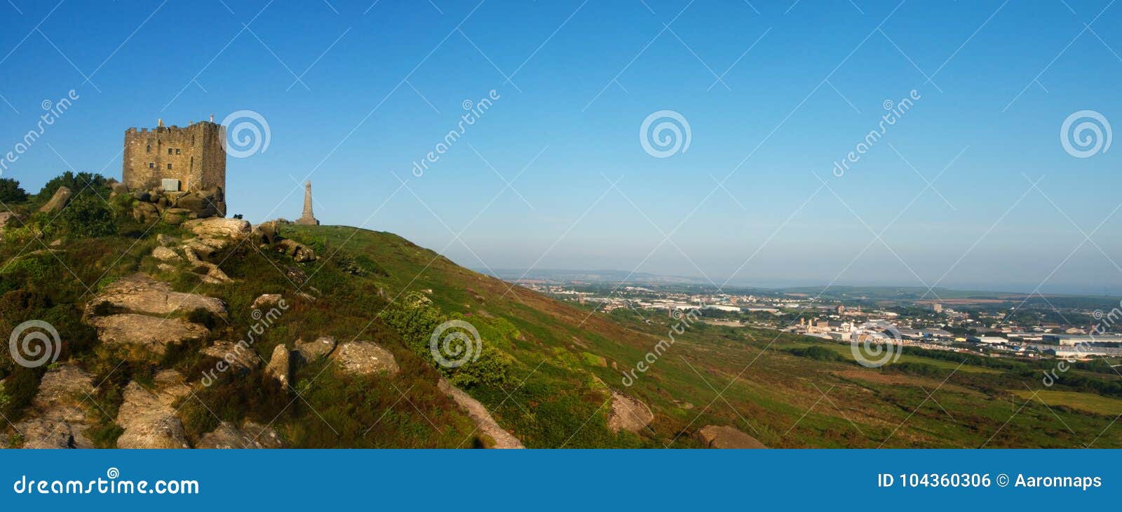 carn brea hill covered in the afternoon sun