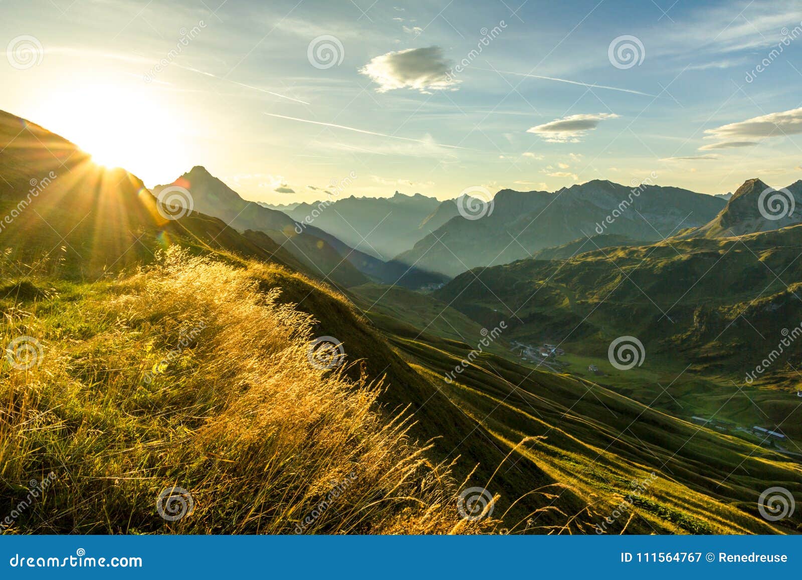 beautiful sunrise and layered mountain silhouettes in early morning. lechtal and allgau alps, bavaria and austria.