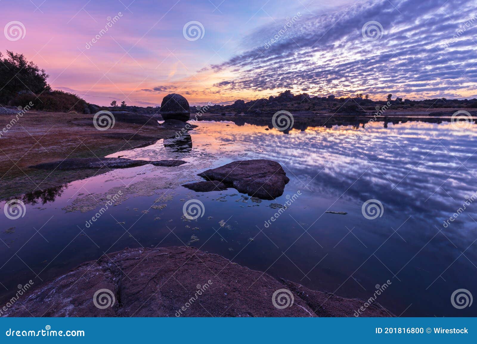 beautiful sunrise in the natural area of barruecos. malpartida de caceres. extremadura. spain