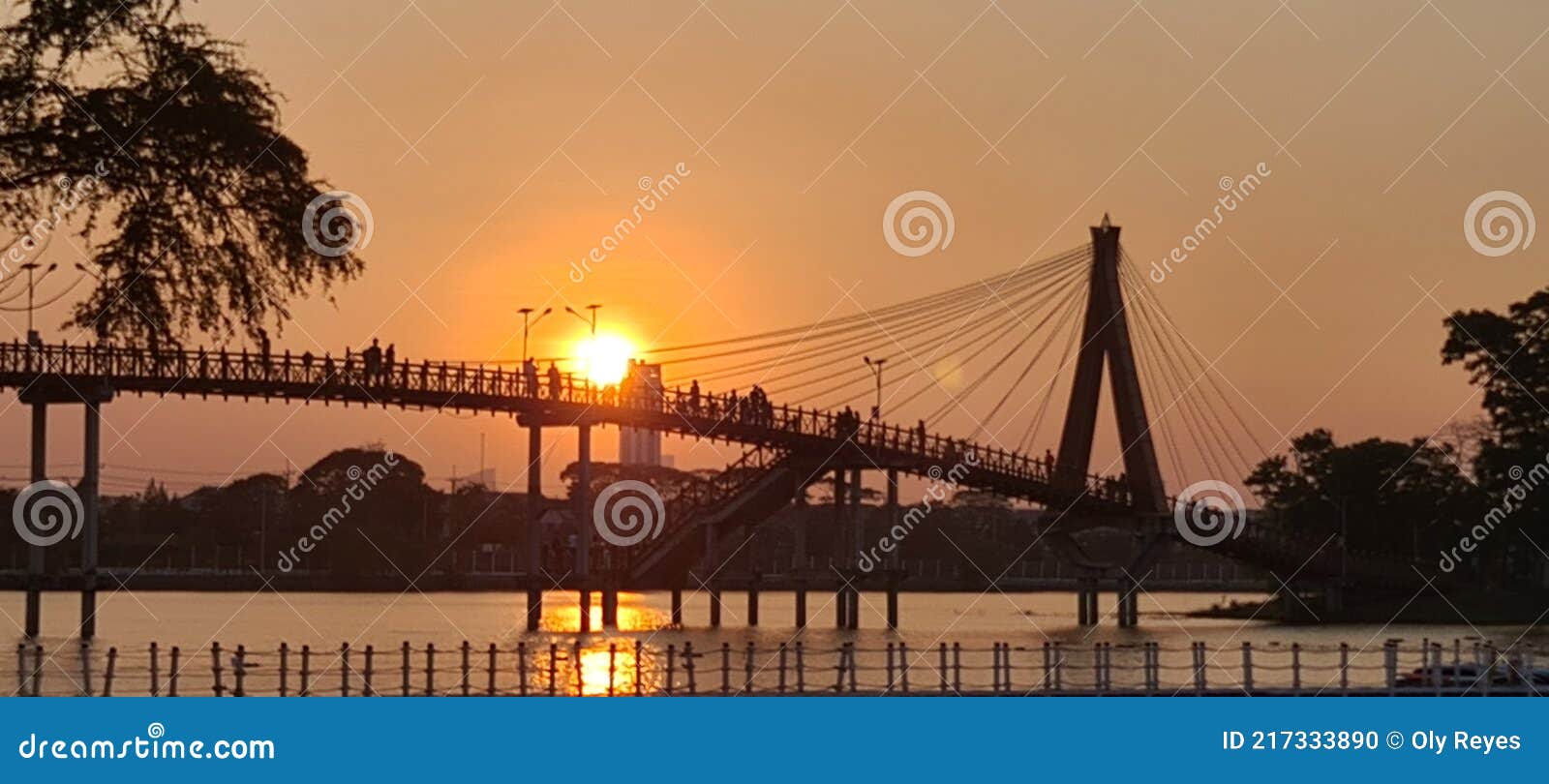 Beautiful Sunset by the Bridge in the Park Sunset View Stock Photo