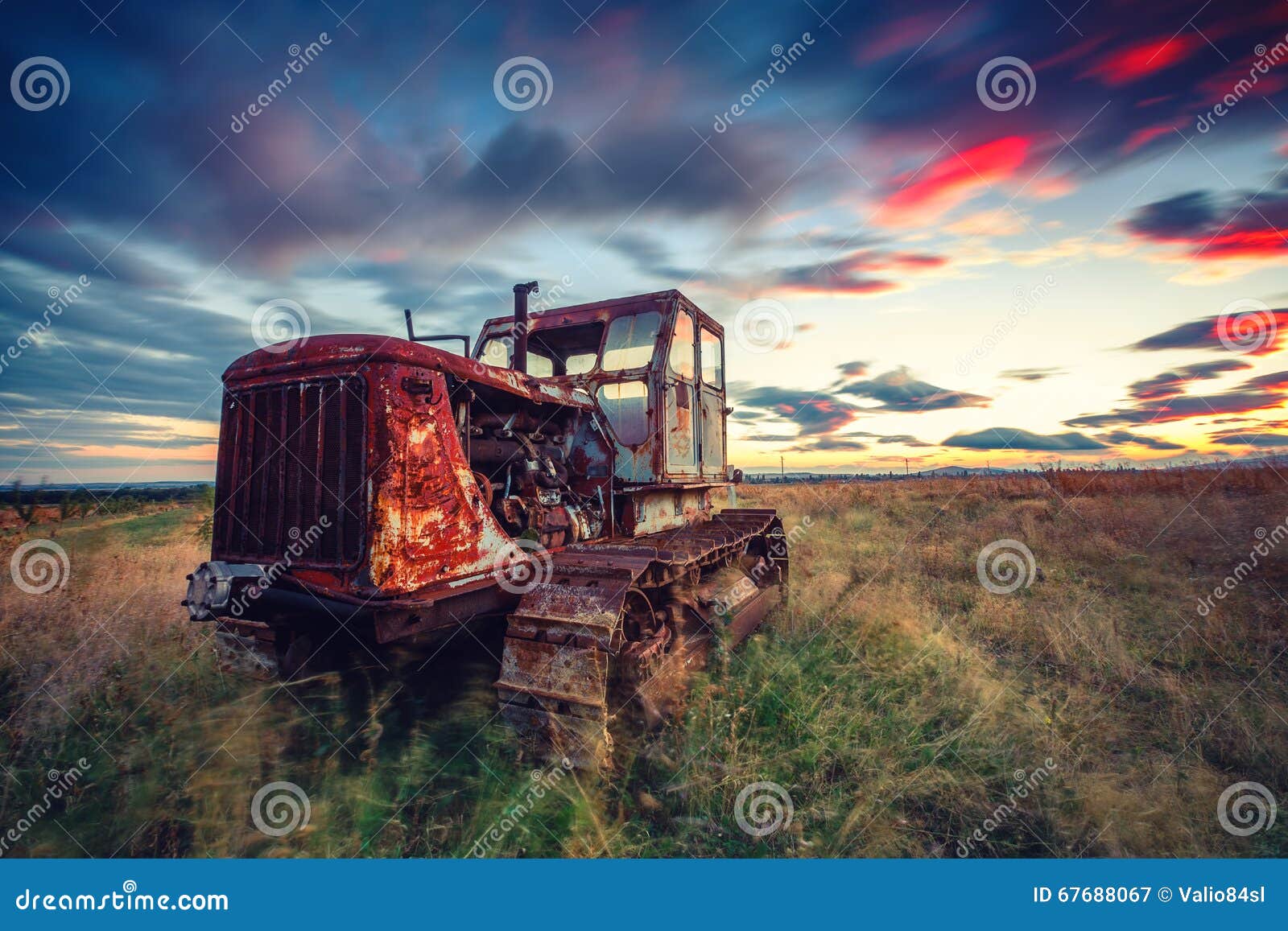Beautiful Sunset Over Field and Old Rusty Tractor Stock Image Image