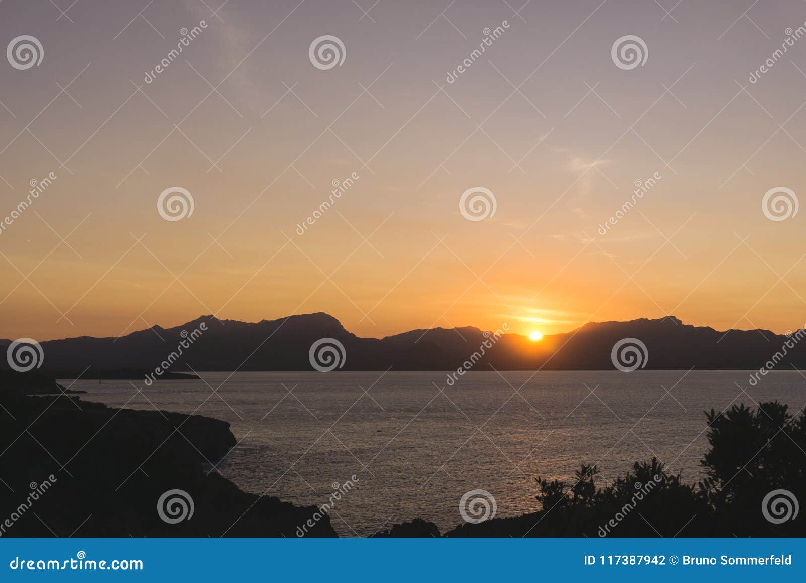 sunset in penya fort majorca spain