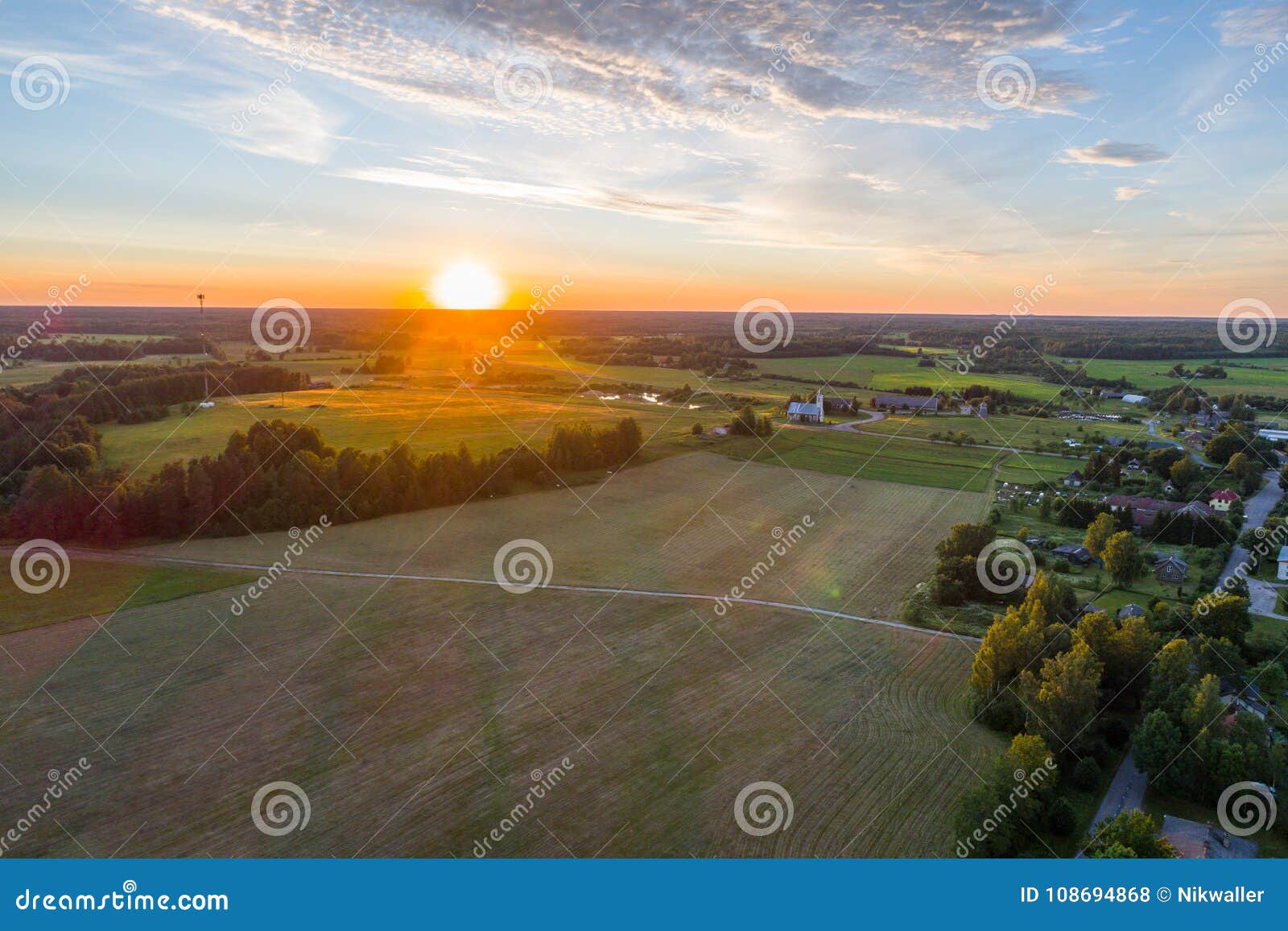 Beautiful Sunset Over the Small Town. Fields and Trees Around. Aerial ...
