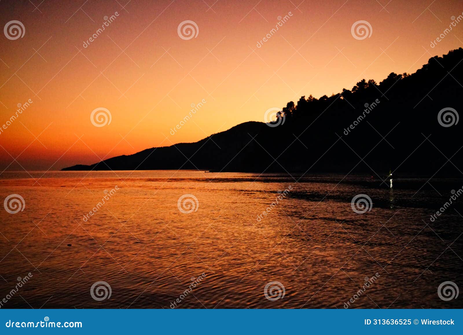 beautiful sunset view over agnontas beach and bay in greece.