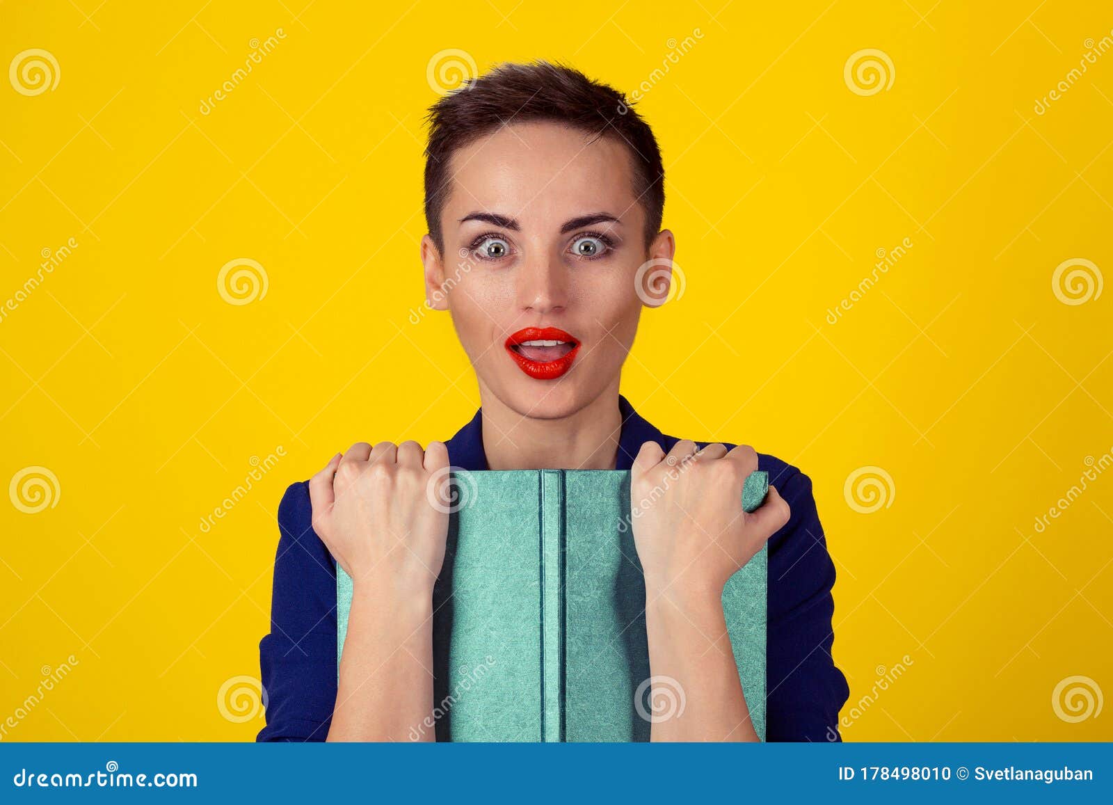 Beautiful Surprised Business Woman Short Hair Style Girl with a Book  Isolated Yellow Background Copy Space. Blue Formal Suit Shirt Stock Photo -  Image of girl, contemporary: 178498010