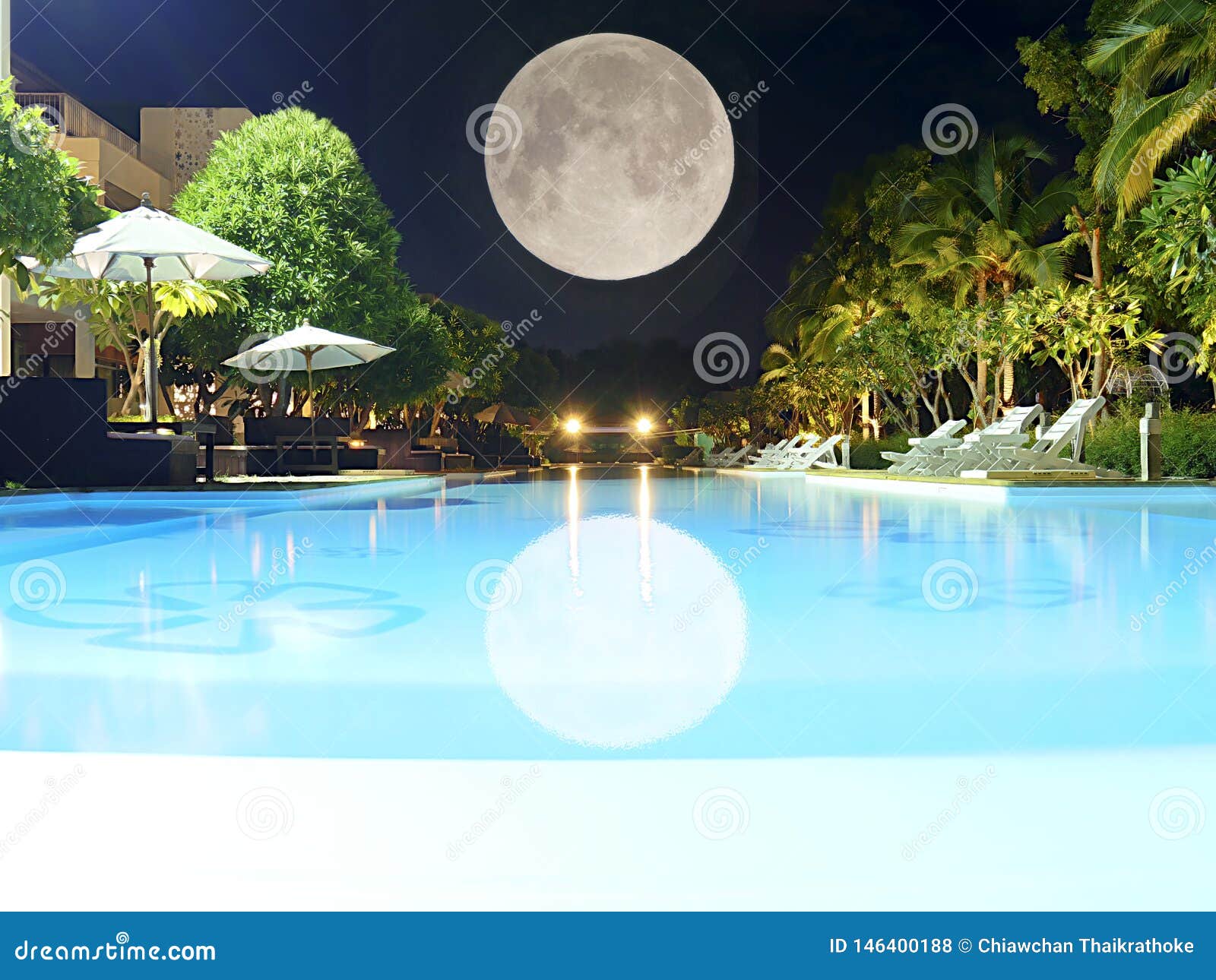 Beautiful Swimming Pool At Night View With Full Moon Umbrella And