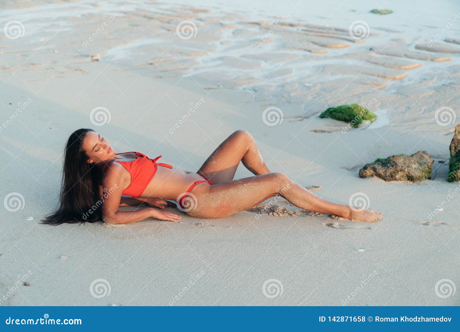 Sexy brunette girl Topless on the Beach