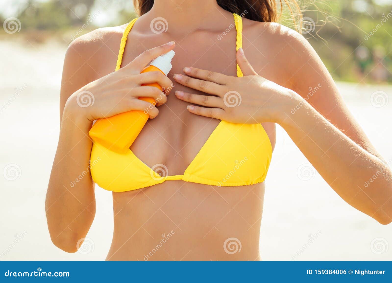 Beautiful Tanned Female Fitness Big Boobs Model Holding Spf Bottle Applying  on the Chest in a Fashion Stylish Swimsuit Stock Photo - Image of beach,  moisturizer: 159384006
