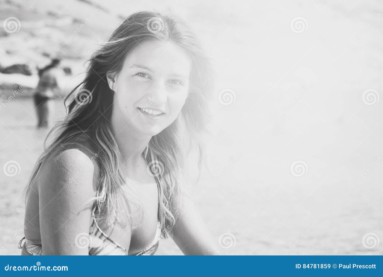 Beautiful Tanned Girl In A Bikini Sitting On A Rocky Beach Stock Image Image Of Post Nature