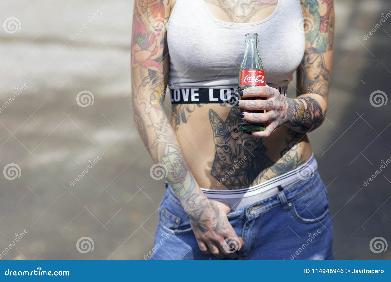 Beautiful Tattooed Woman Holding a Bottle of Coca-Cola Original. Editorial  Photo - Image of fresh, blue: 114946946