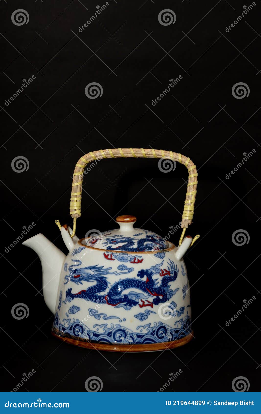 A Beautiful Tea Pot with Handle and Traditional Chinese Dragons Made on