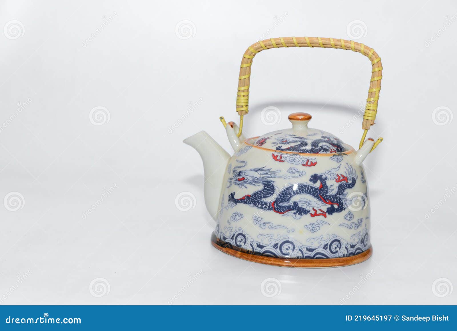 A Beautiful Tea Pot with Handle and Traditional Chinese Dragons Made on