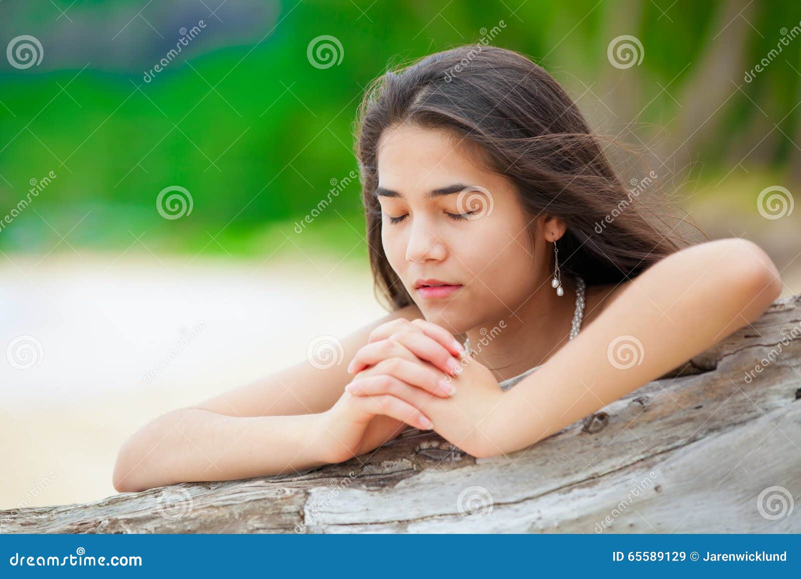 Women Praying On The Beach