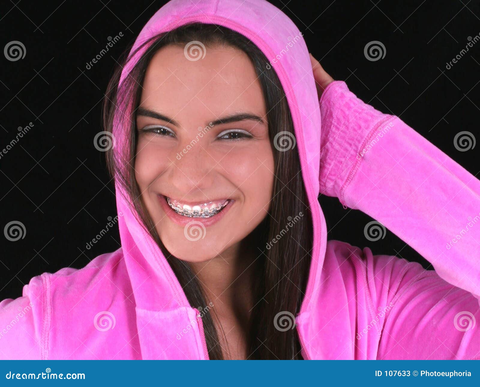 Beautiful Teen Girl with Braces in Pink Hooded Jacket Stock Image