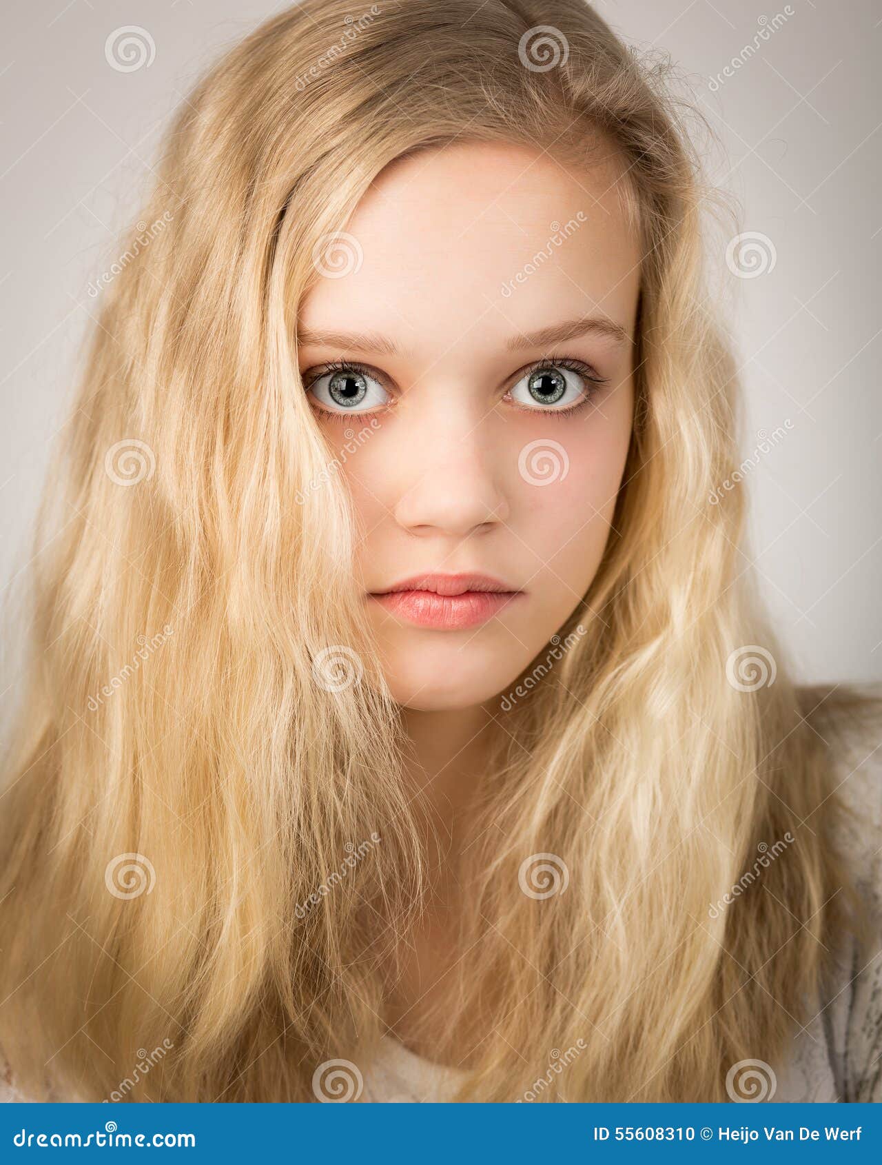 Beautiful Blond Teenage Girl Looking In The Camera Royalty