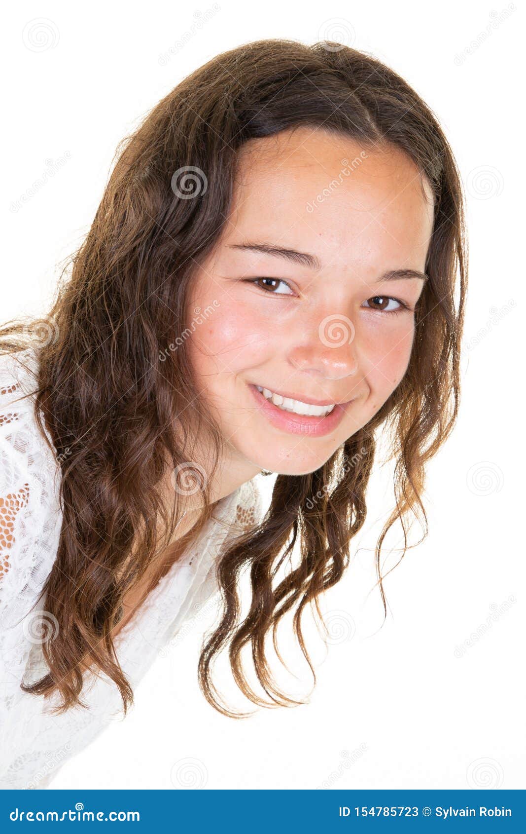 Beautiful Teenage Girl with Mysterious Smile Posing Indoors at Blank ...