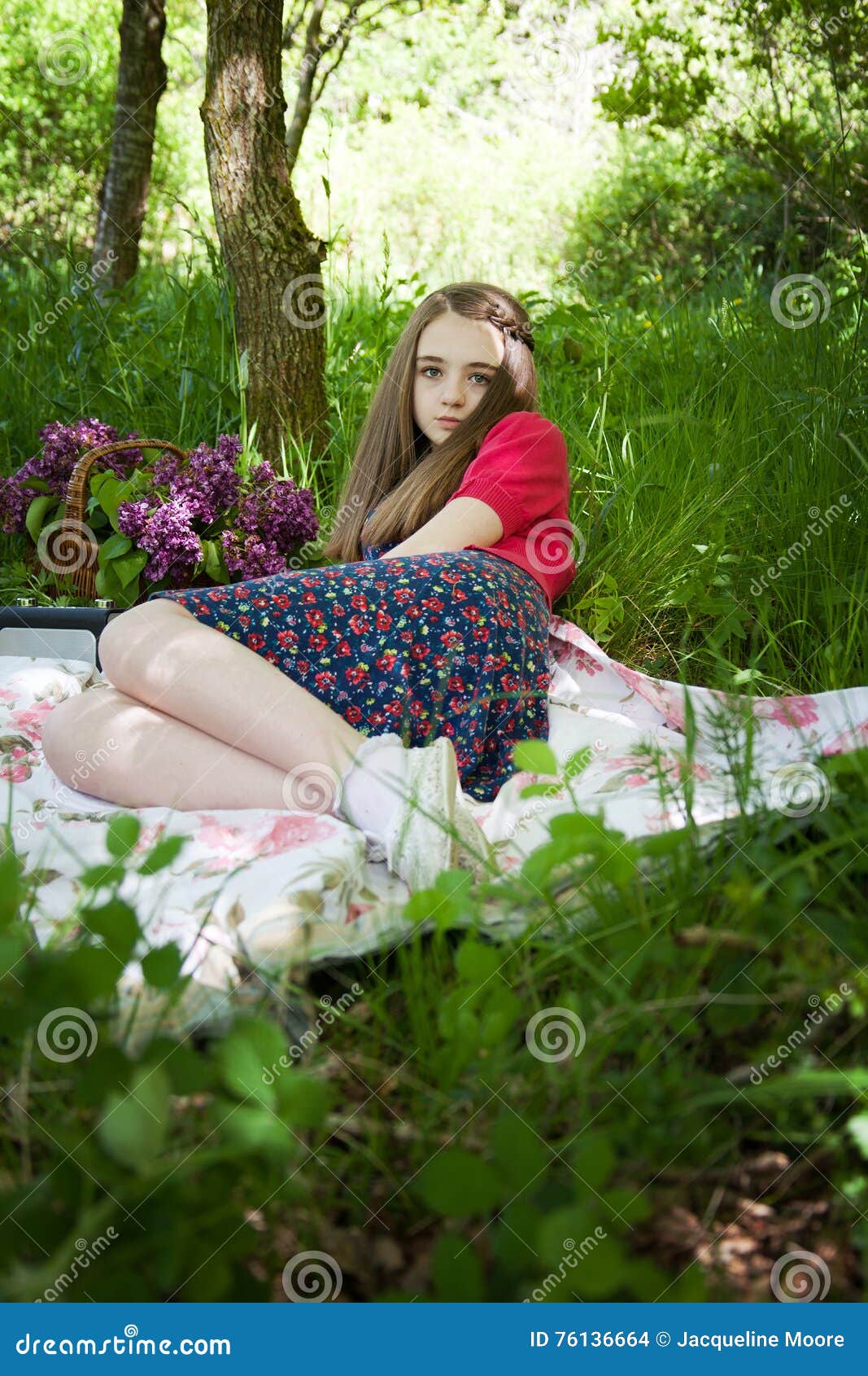 Beautiful Teenage Girl Sitting on a Blanket in a Forest Stock Photo ...