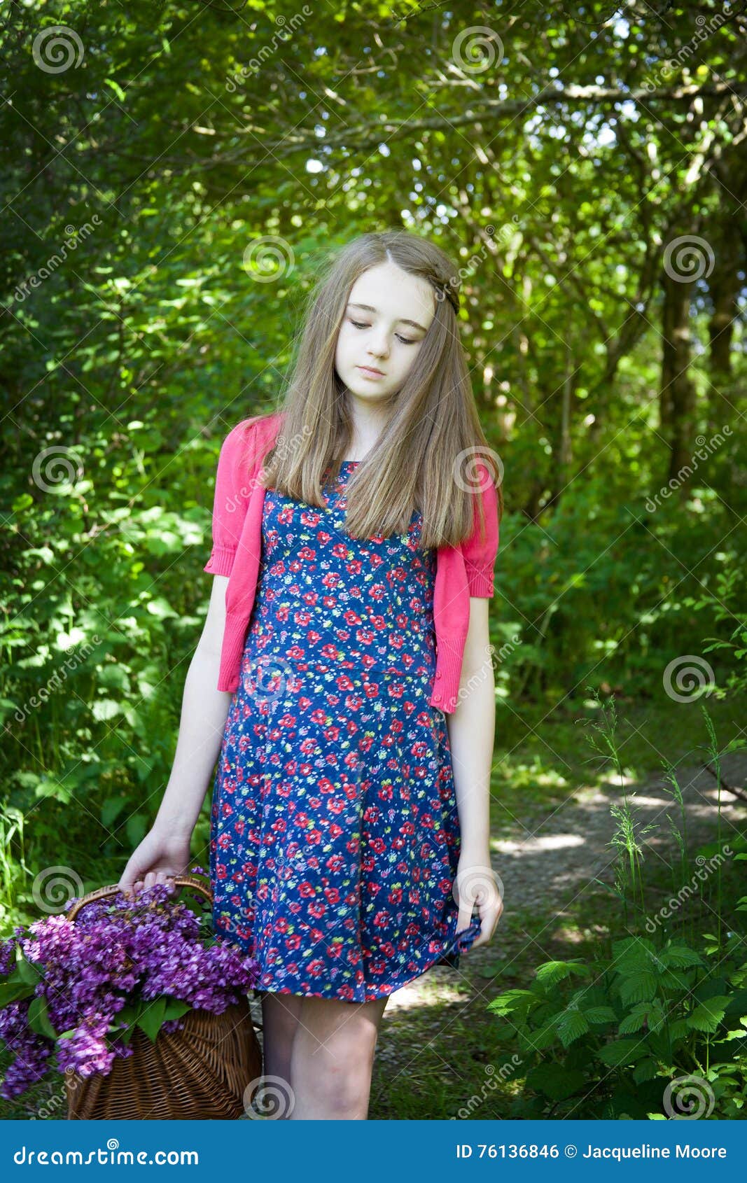 Beautiful Teenage Girl Walking in Woods with a Basket of Flowers Stock ...