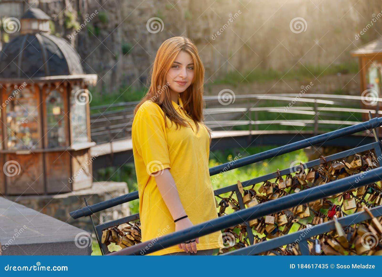 Beautiful Teenage Girl In Yellow Shirt In Old City Park Stock Image 