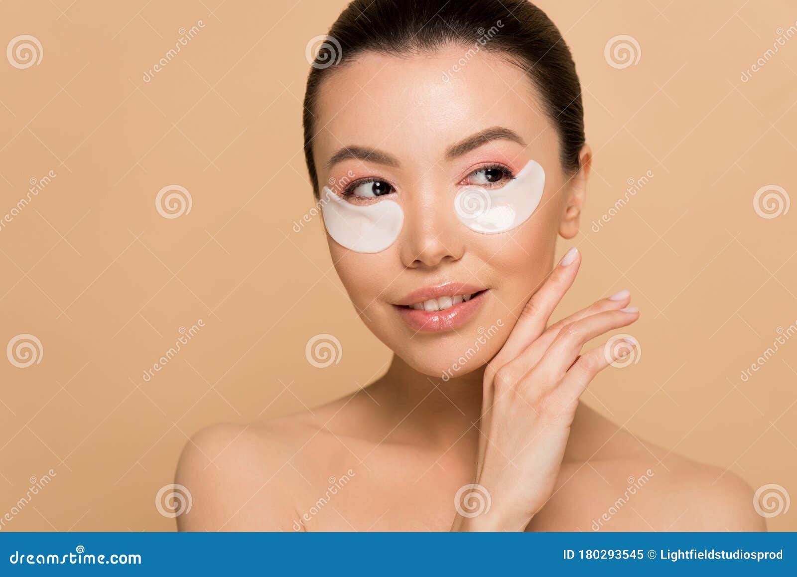 Beautiful Tender Nude Asian Girl With Collagen Eye Pads Stock Image