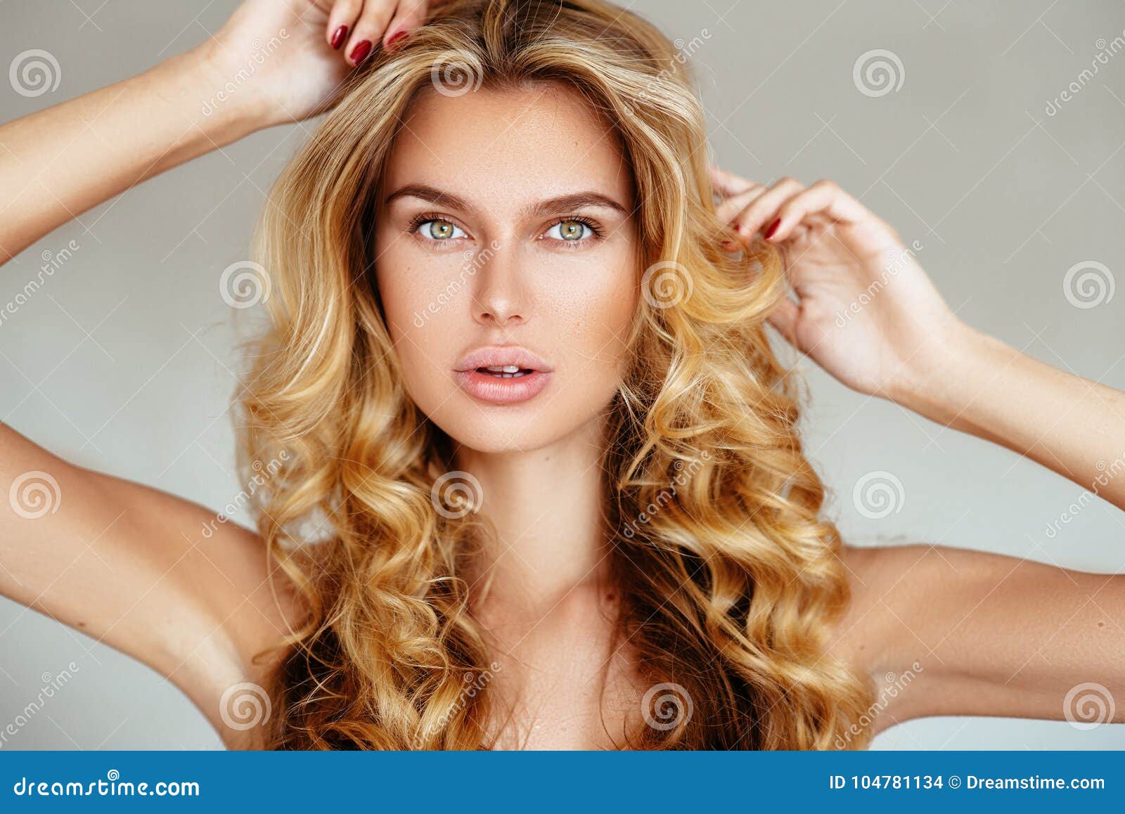 Beautiful Tender Blonde Girl With Long Hair And Puffy Lips Without Makeup Posing In Pink