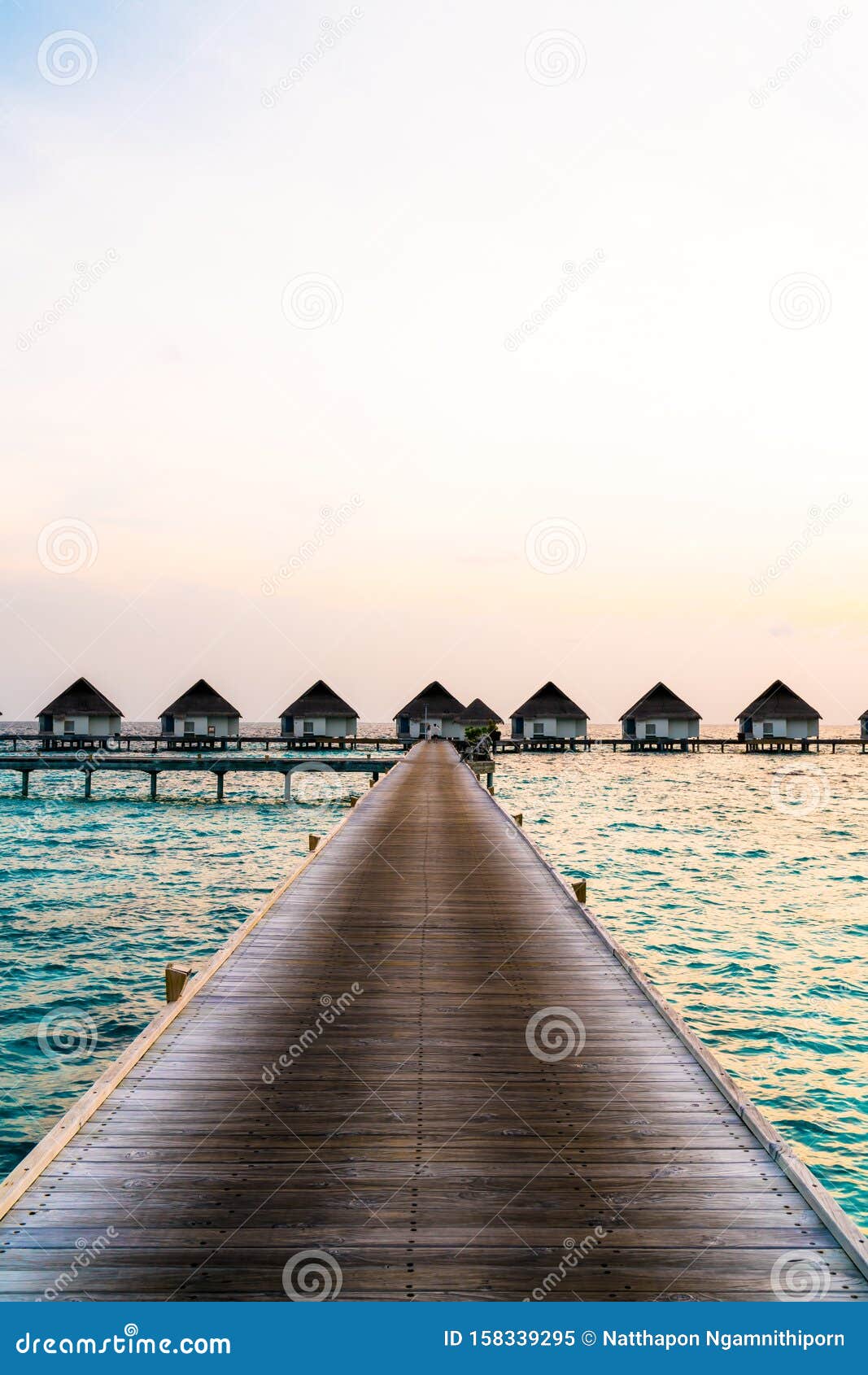 Beautiful Tropical Sunset Over Maldives Island With Water Bungalow In