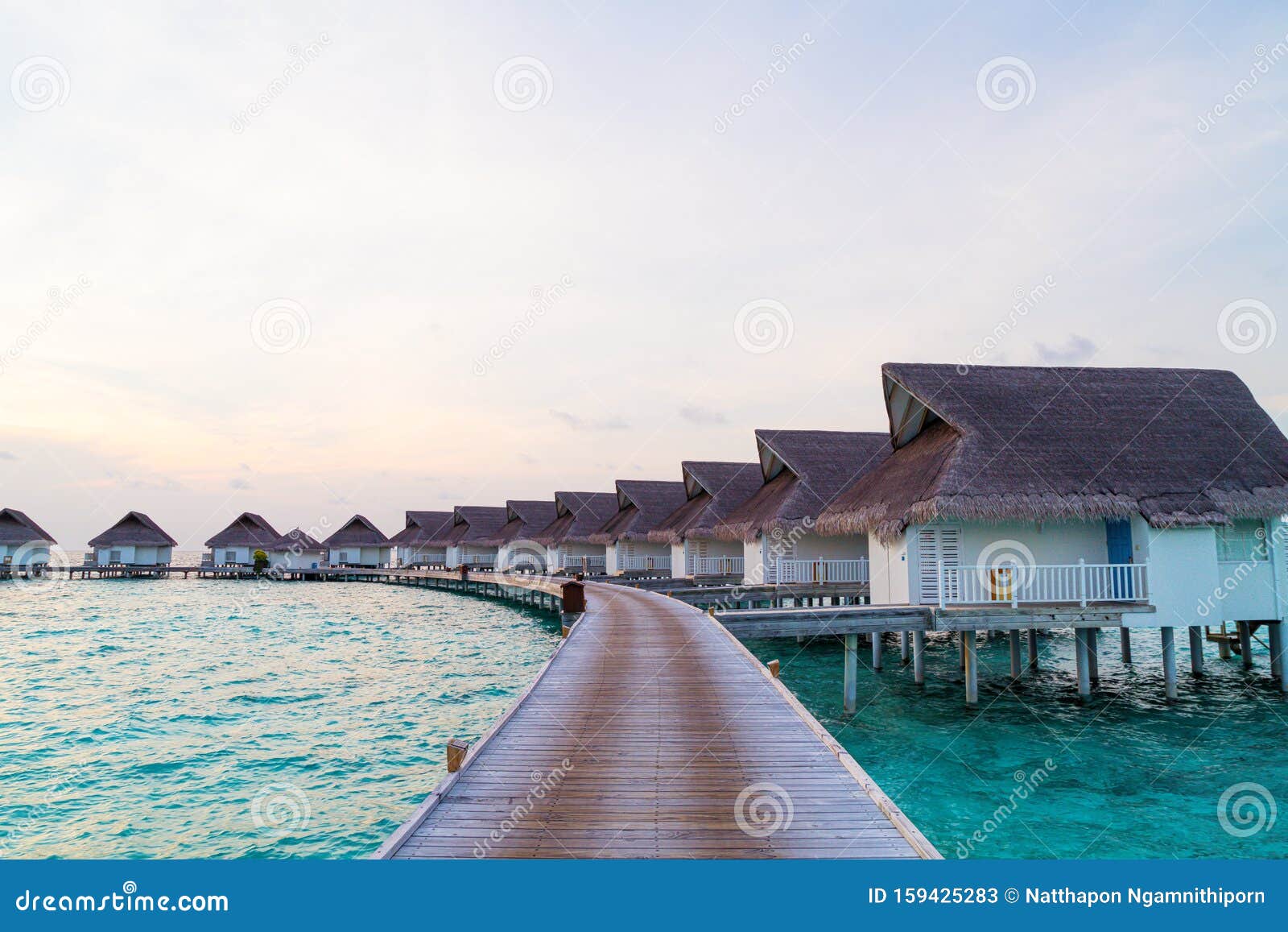 Beautiful Tropical Sunset Over Maldives Island With Water Bungalow In