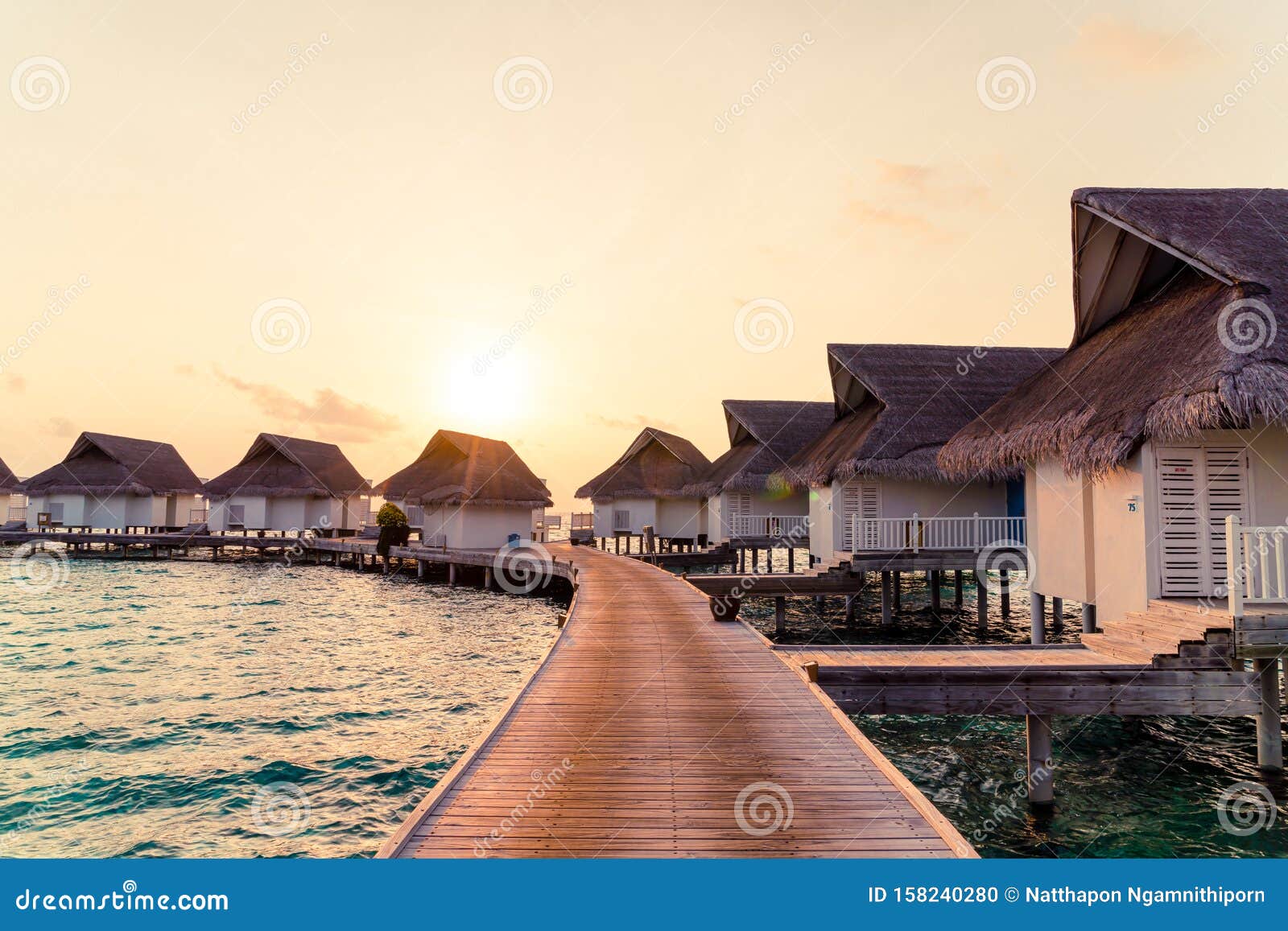 Beautiful Tropical Sunset Over Maldives Island With Water Bungalow In