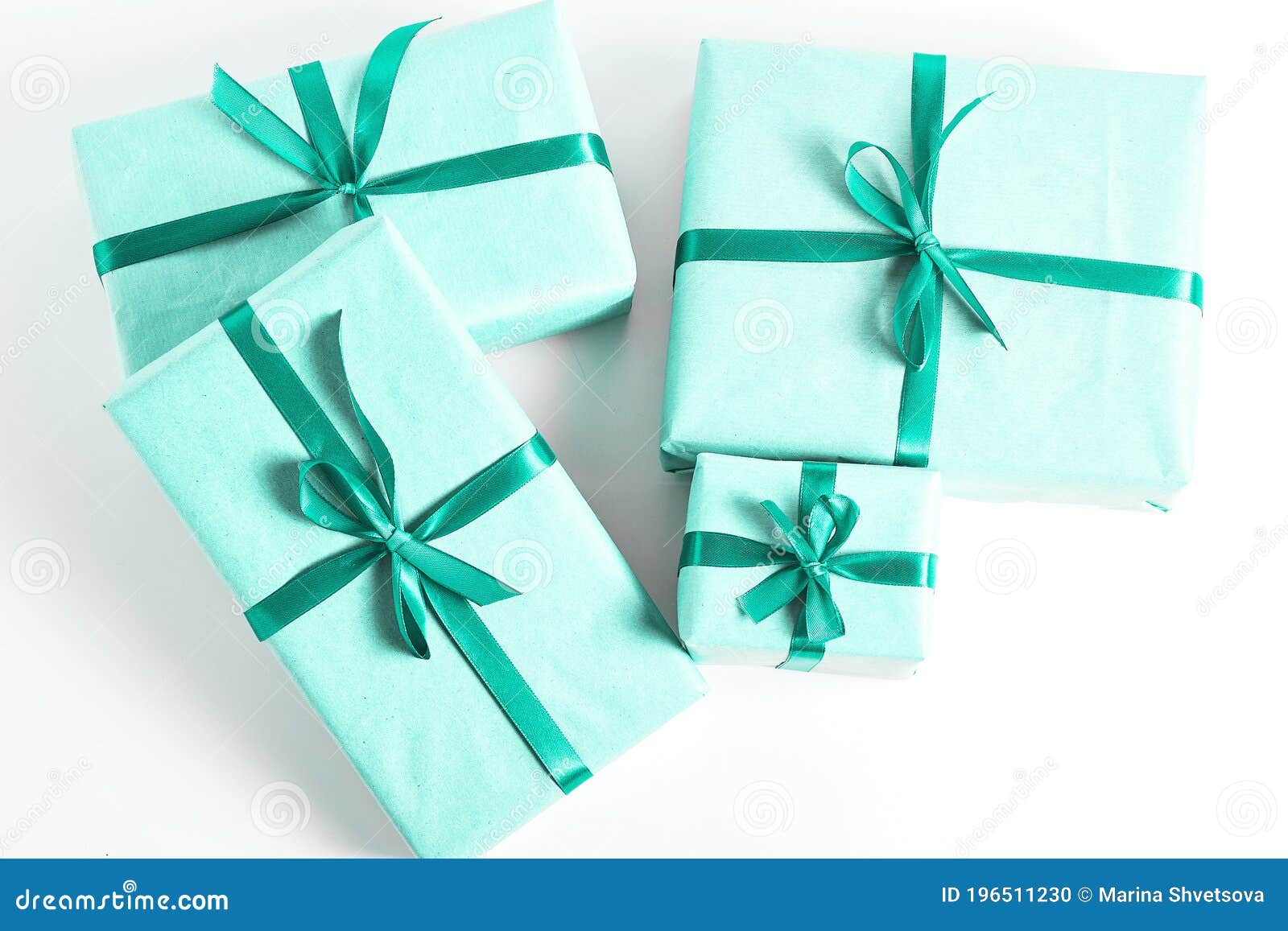 Beautiful Turquoise Gift Boxes Decorated With A Satin Ribbon On A White