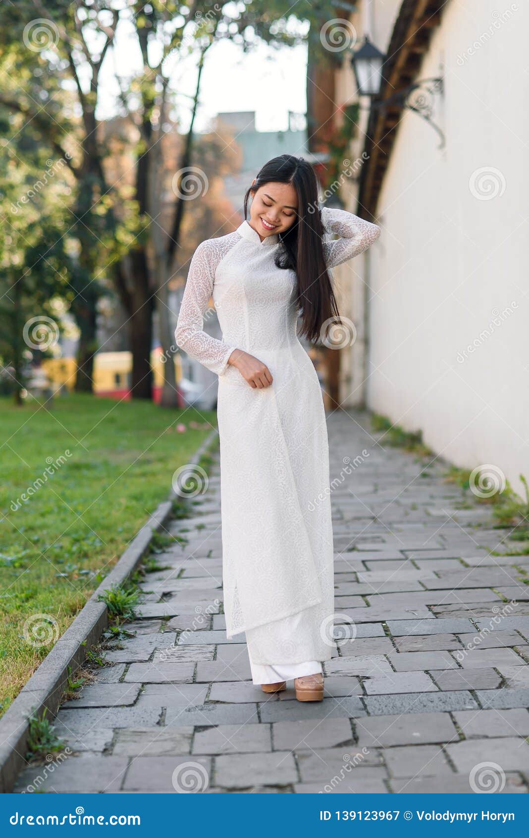 Vietnamese Girl Dressed Ao Dai White Dress. Vietnamese 