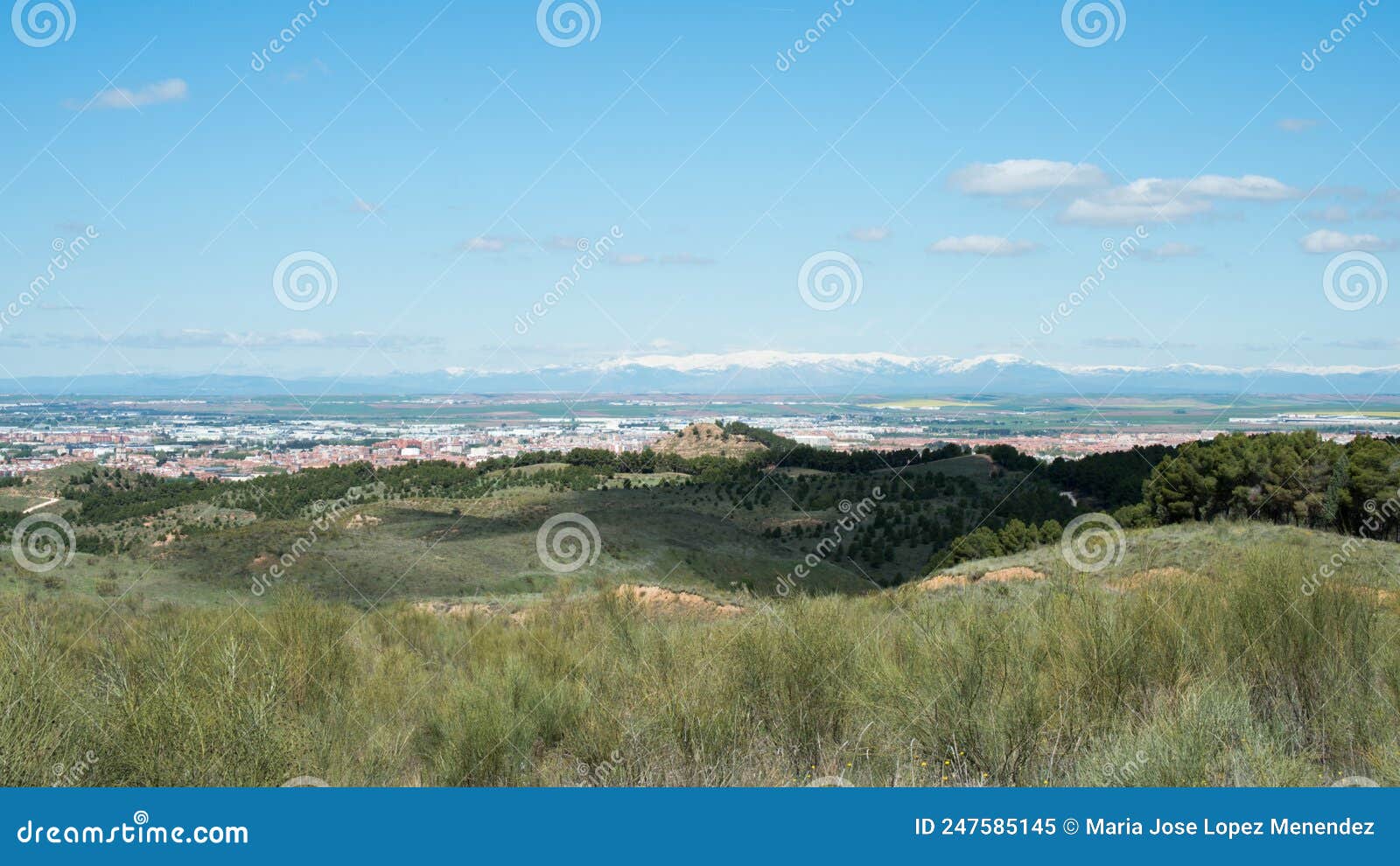 beautiful view of alcala de henares from los cerros park. mountains with snow in the distance. madrid