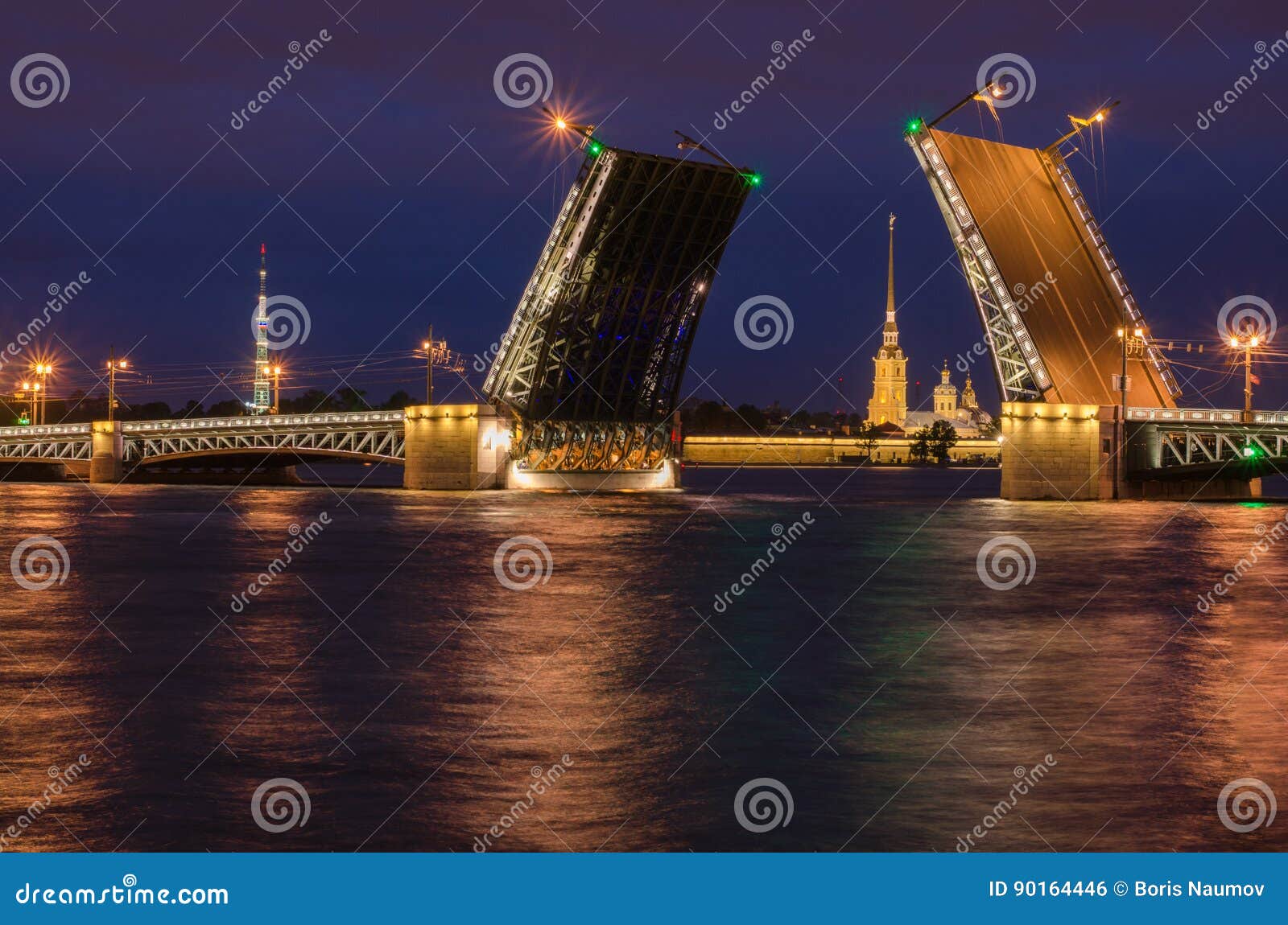 beautiful view of the breeding of bridges in the night st. petersburg from the embankment of the neva river