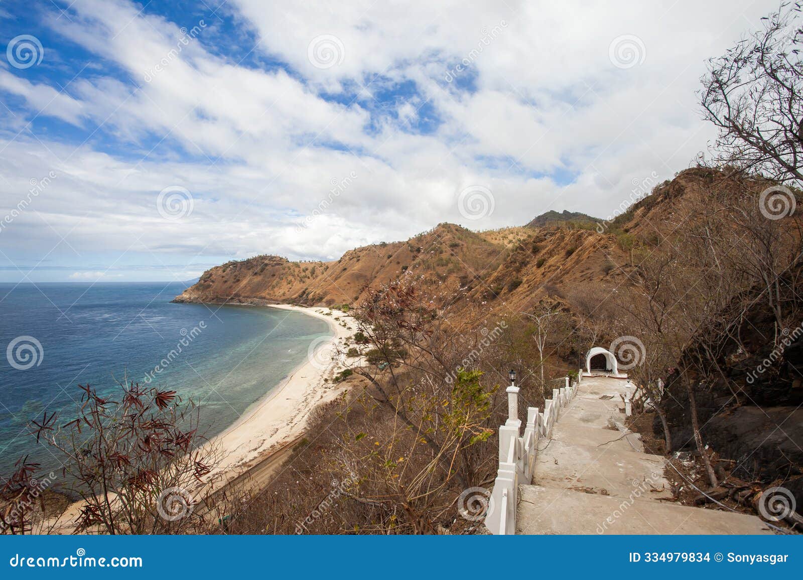 the beautiful view of christo rei beach seen from the top of futu cama hill in dili, timor leste