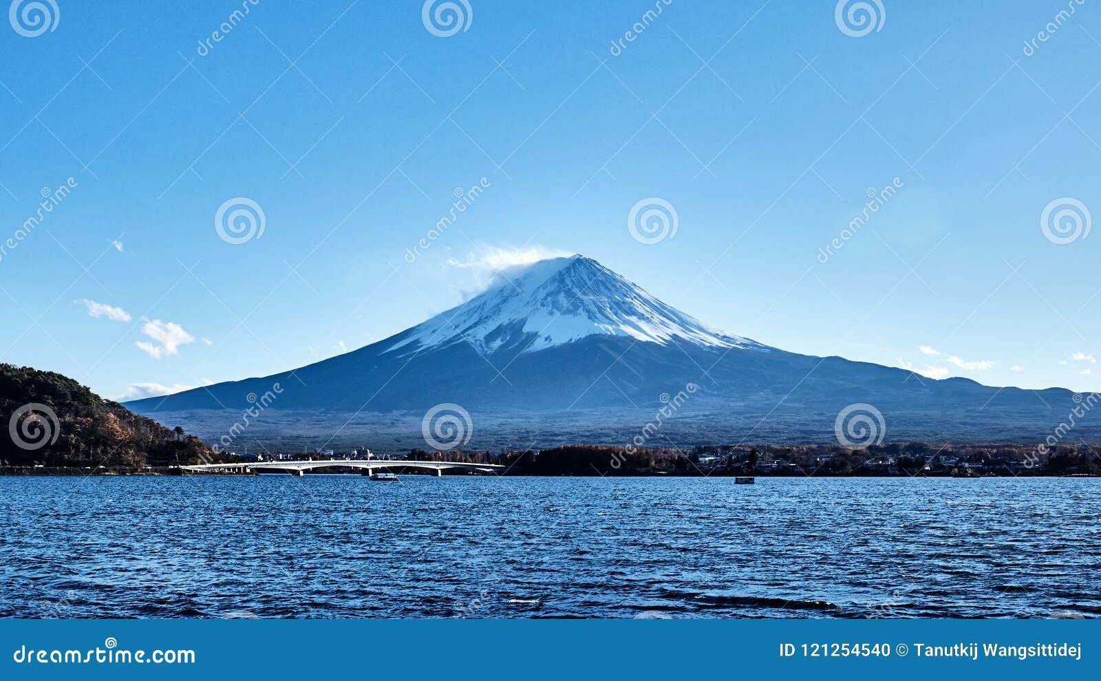beautiful view mt.fuji with snow capped, blue sky and the bridge at kawaguchiko lake, japan.