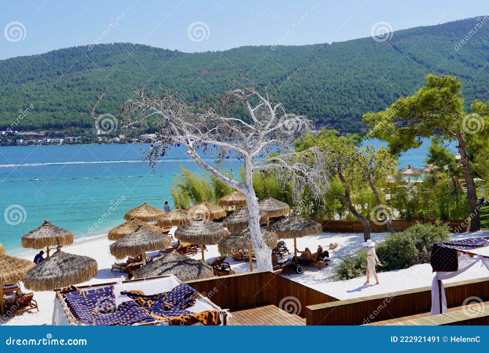 beautiful view of paradise tropical bodrum beach at lujo hotel in turkey, beach bed, bean bag chair and umbrella for