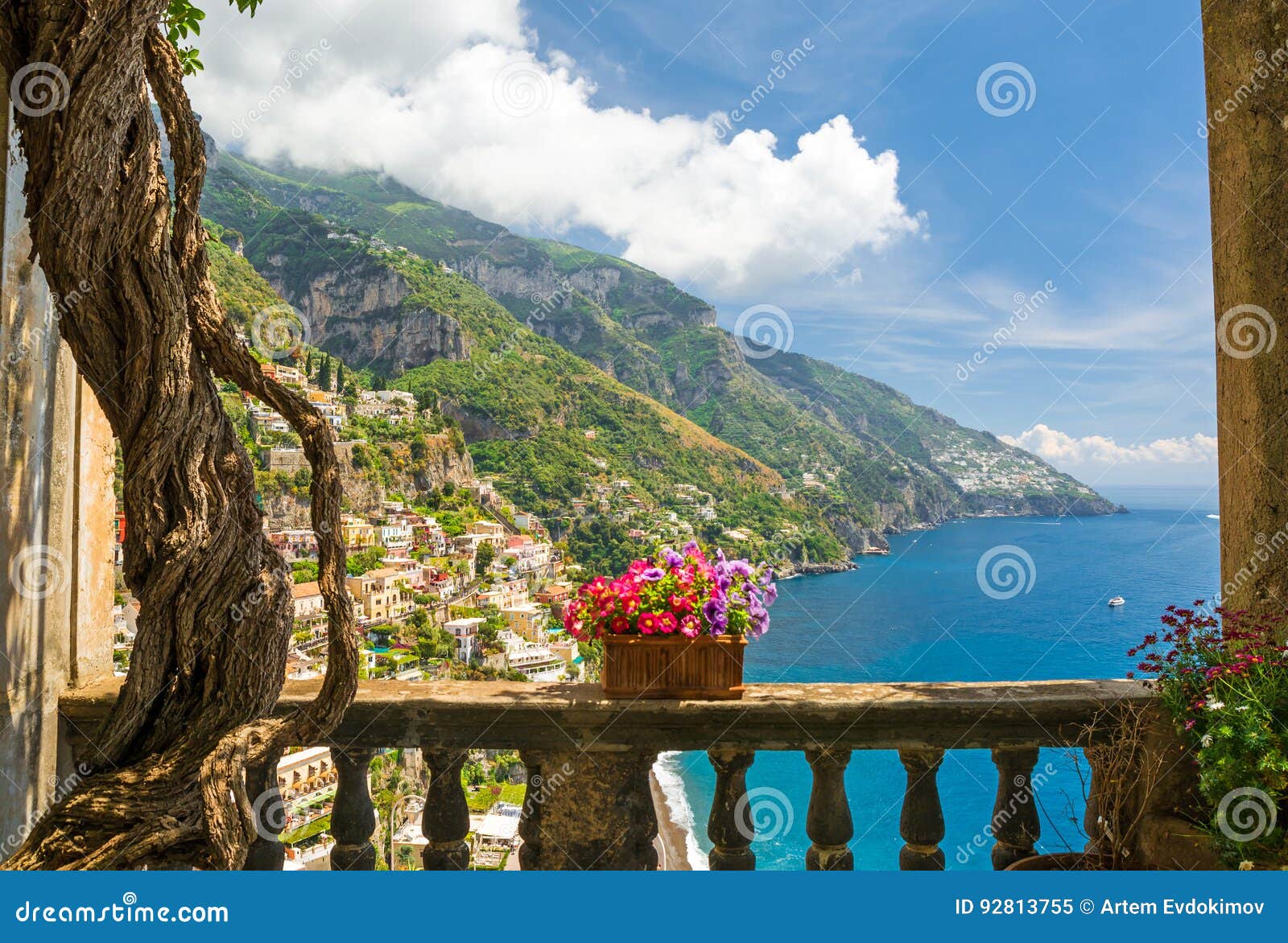beautiful view of the town of positano from antique terrace with flowers