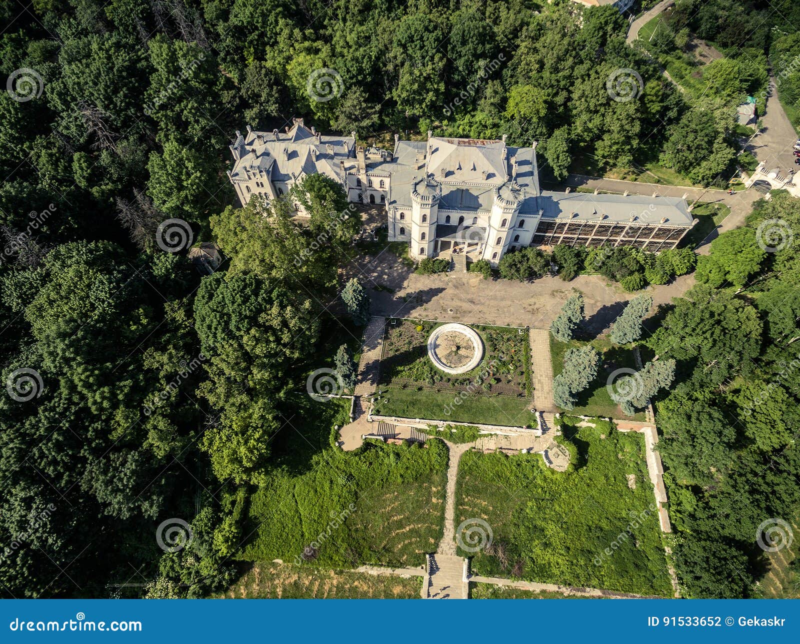 beautiful view on white swan palace and yard in sharivka park, kharkiv region