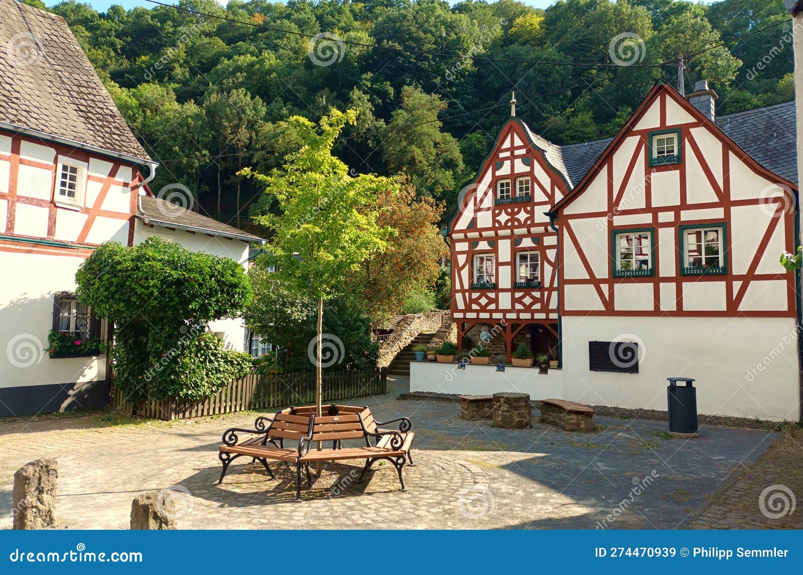 beautiful villages: half timbered houses and a bench inmonreal in rhineland-palatinate