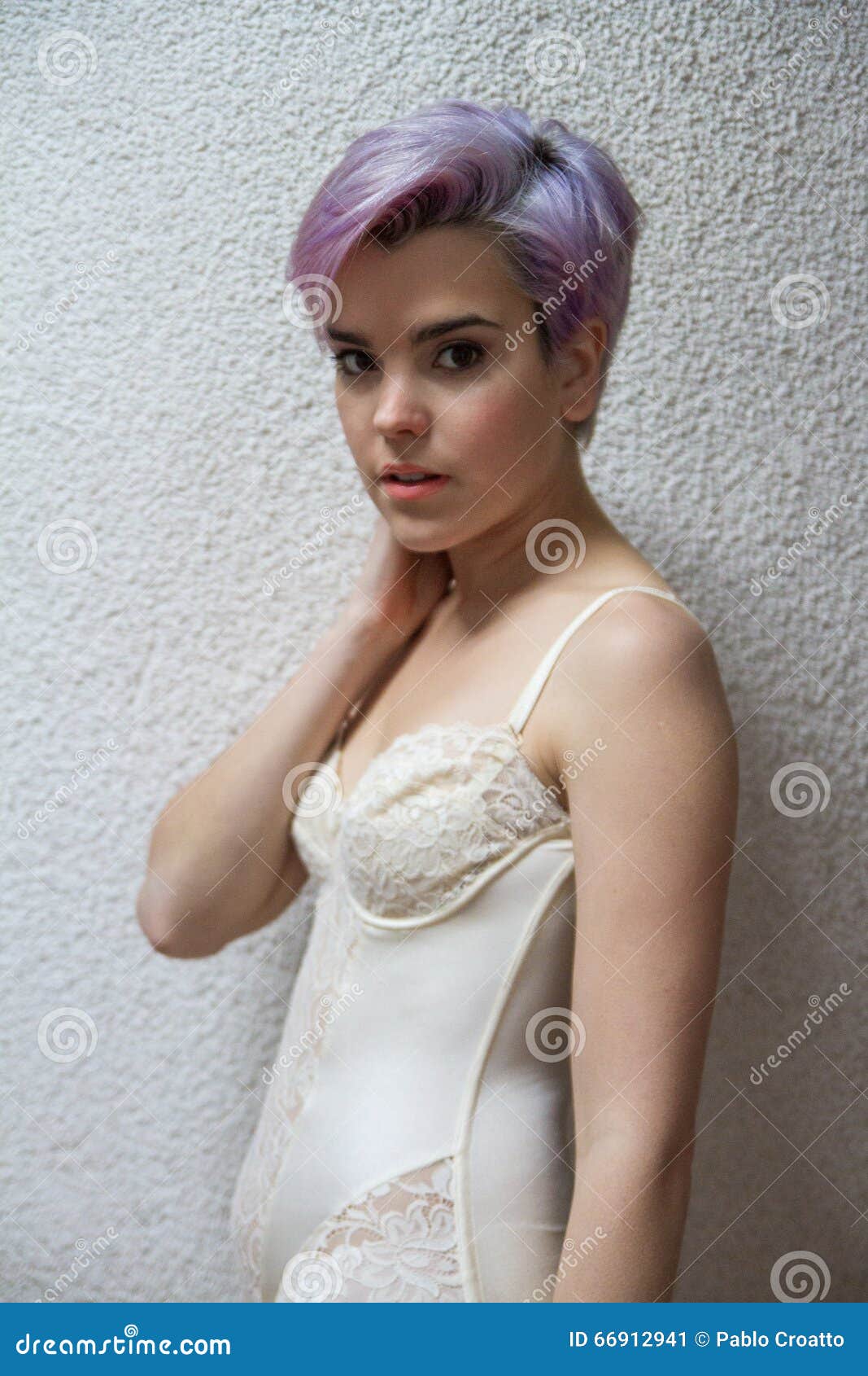 Beautiful Violet Short Haired Girl Looking At Camera Indoors Stock
