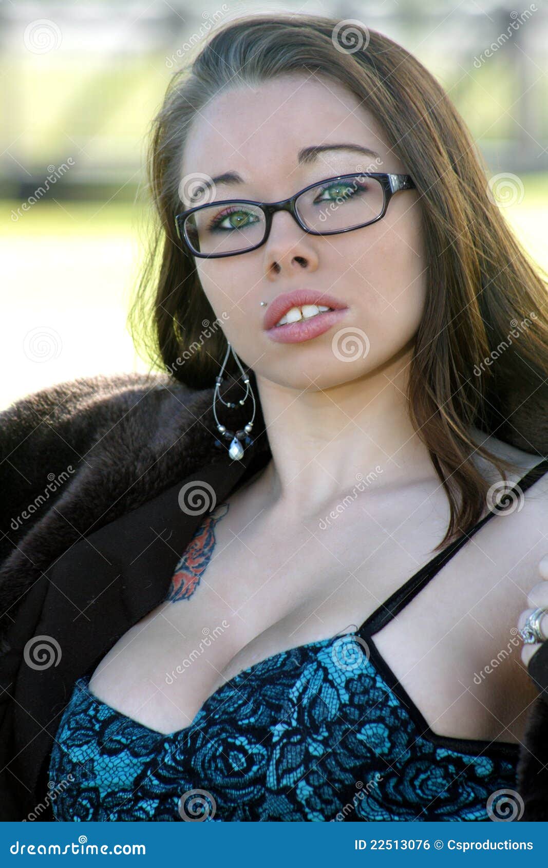 Beautiful, Voluptuous Brunette Outdoors (4). A close-up of a lovely, voluptuous, young brunette outdoors.