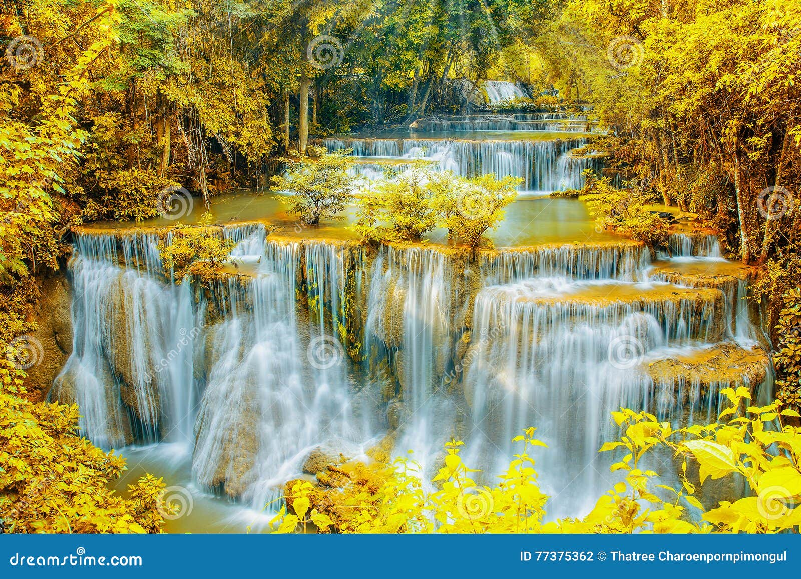 Beautiful Waterfall In Autumn Forest With Ray Light Stock Photo