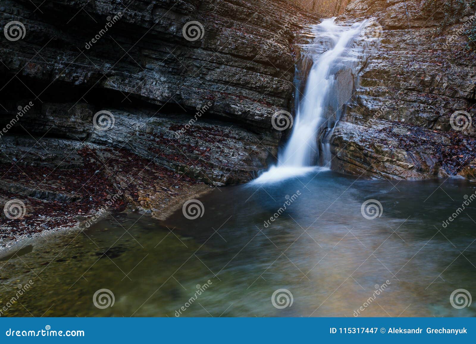 Beautiful Waterfall At Mountain River In Colorful Autumn Forest With