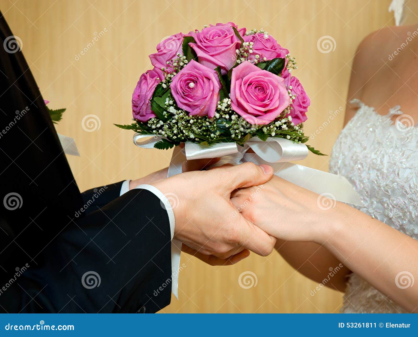 beautiful wedding bouquet in brides and grooms hands