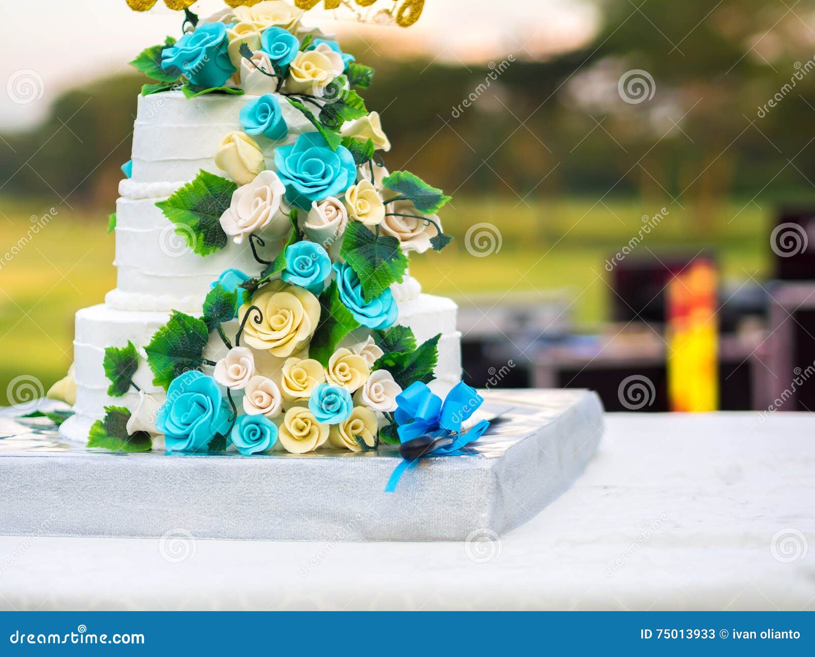 Beautiful Wedding Cake with Blue and Yellow Roses Stock Image ...