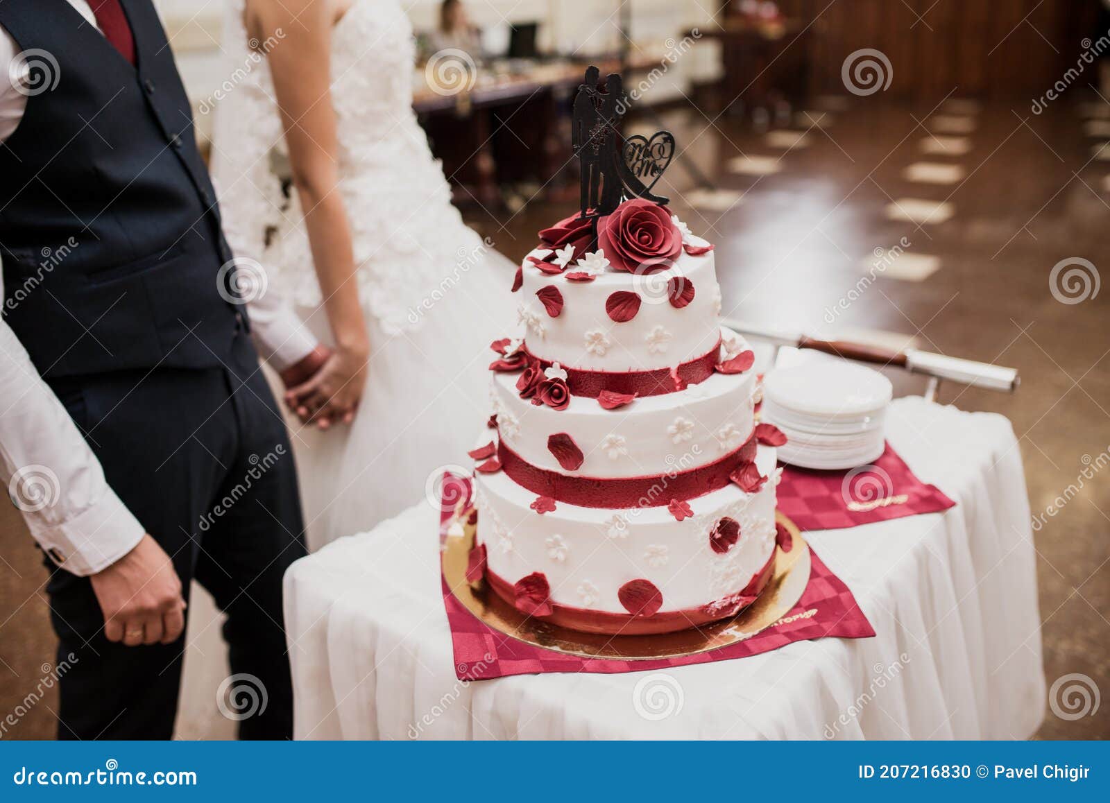 Beautiful Wedding Cake Bride and Groom Cut into Pieces Stock Photo