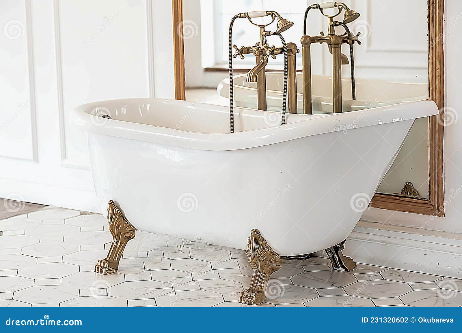 A Beautiful White Baroque Bathtub with Gold Legs and a Faucet Stands in ...