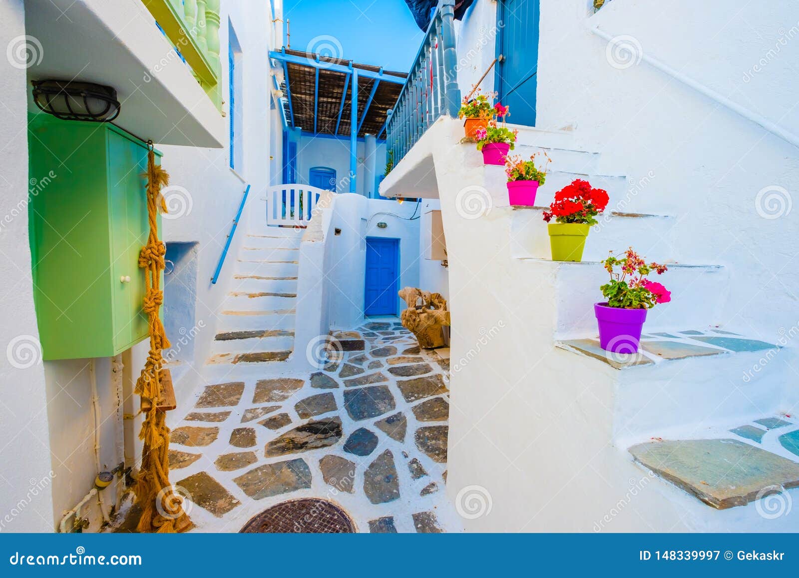 beautiful white building`s courtyard view on the greek street