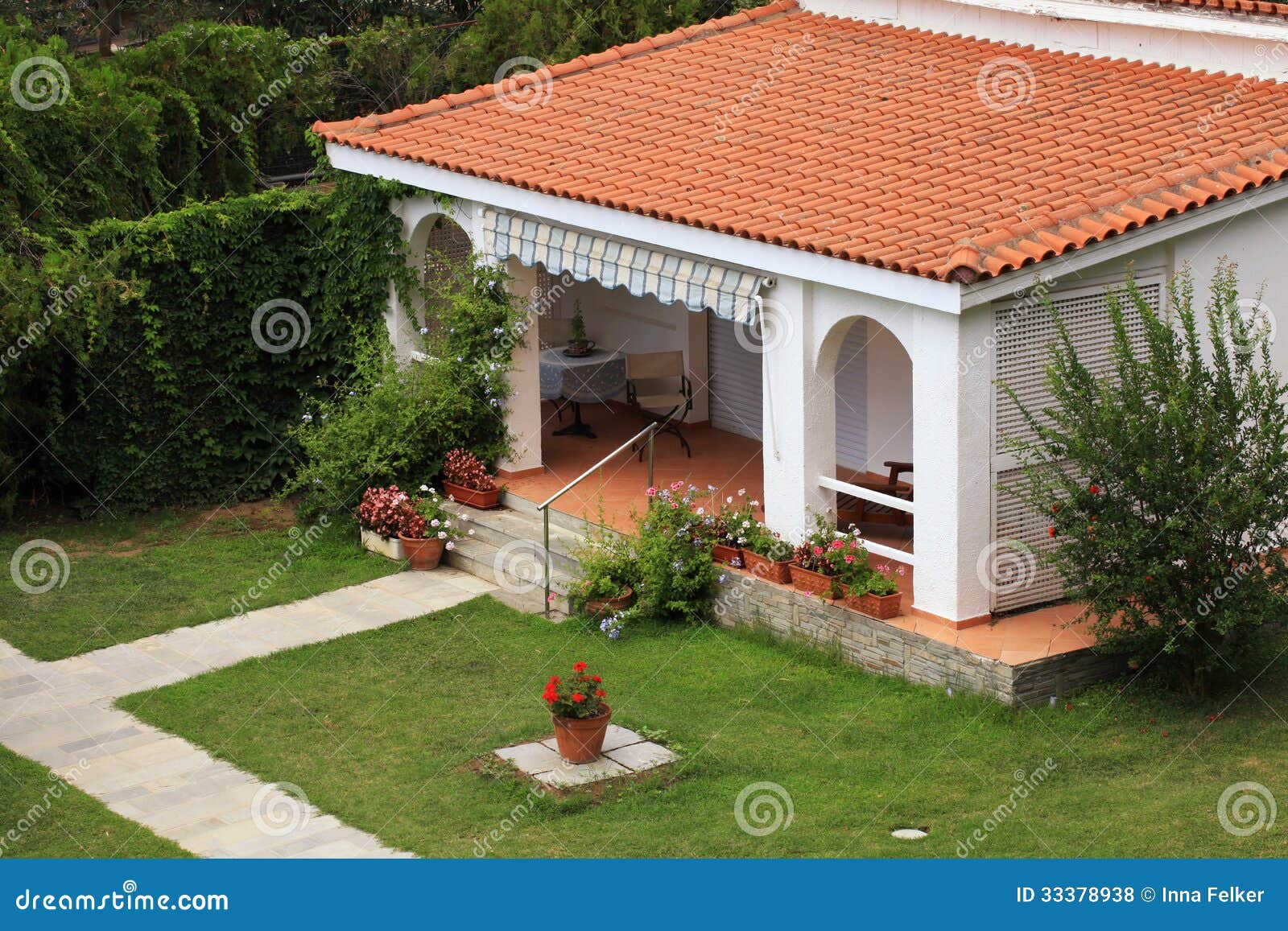 Beautiful White House with Small Terrace in the Garden. Stock ...